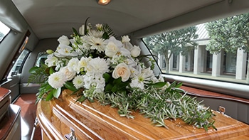 Coffin and flowers - funeral arrangements darwin