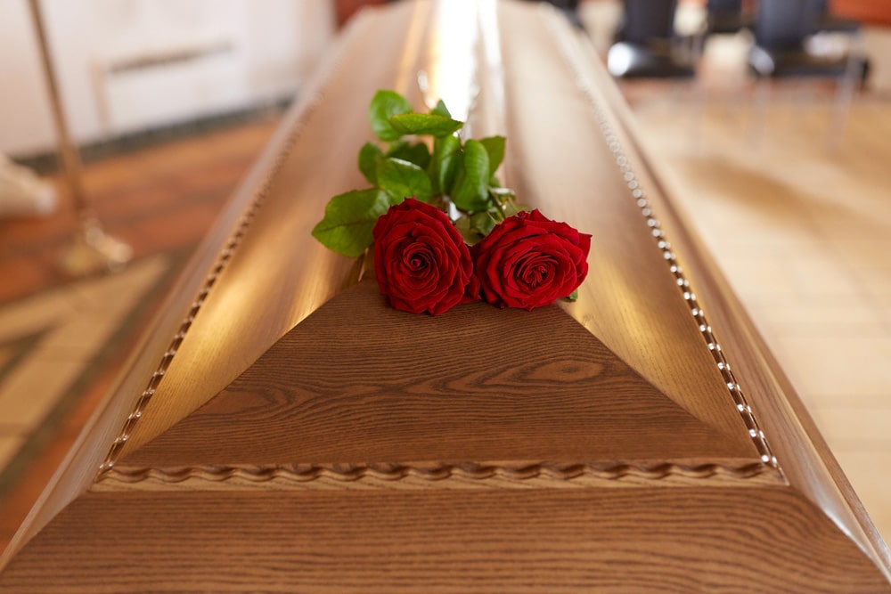 coffin with rose - Funeral Service in Holtze NT