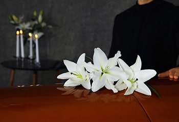 White flower on top of coffin - Funeral Service in Holtze NT