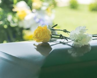 Yellow Flower on top of a coffin - Funeral Service in Holtze NT